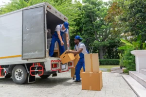 Edmonton moving crew packing boxes and loading a truck