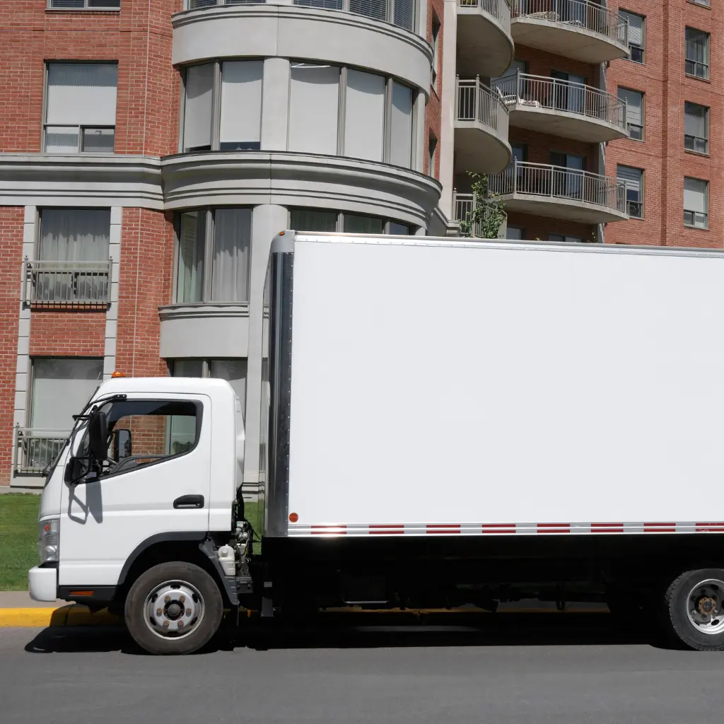 movers carrying furniture through a condo hallway in Edmonton