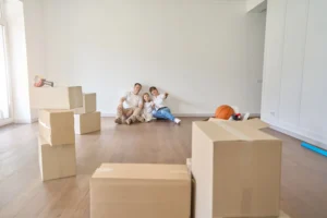 Moving crew handling furniture on townhouse stairs compared to open access at a detached house