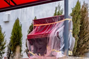 professional movers relocating a piano using specialized moving equipment